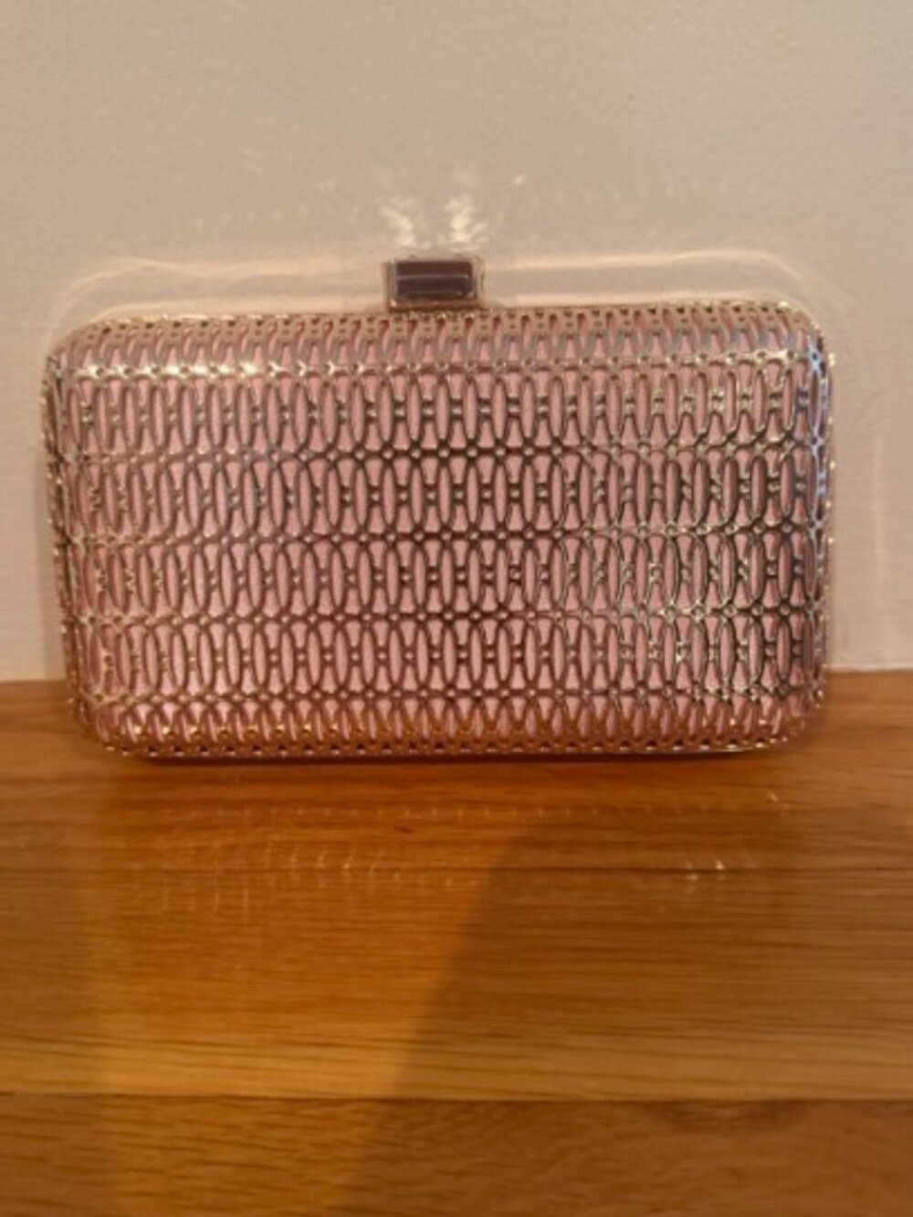 Pink and gold clutch with chain
